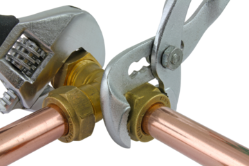 Plumber using wrenches adjusting pipework ,transparent png.