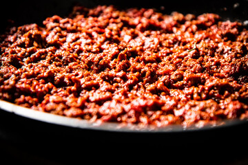 Delicious bolognese sauce in a frying pan. 