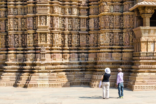 Tourist visiting Khajuraho Hindu temples with a guide, Khajuraho, India
