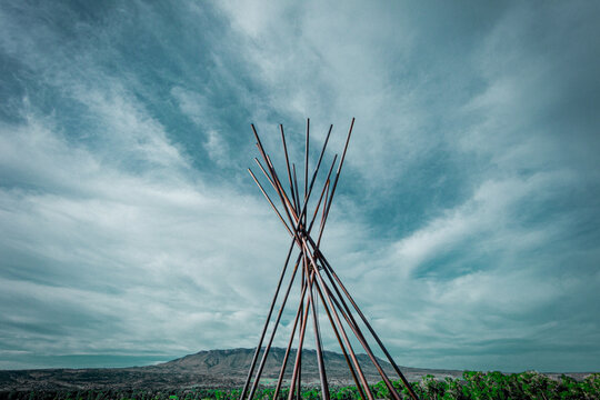 Tepee frame against the Big Sky in Montana. 
