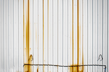Rusty white corrugated metal warehouse building background