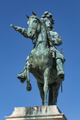 Equestrian statue of Louis XIV (1836) in front of Palace of Versailles. Palace Versailles was a...