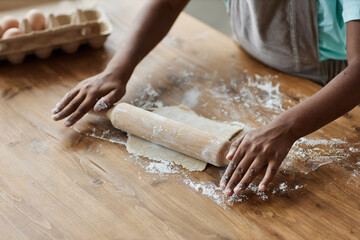 Black little girl baking homemade pastry