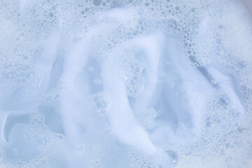 Obraz premium Top view of towel soak in powder detergent water dissolution. Laundry concept