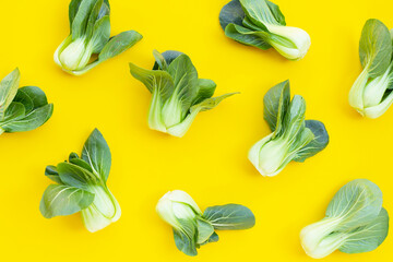 Bok choy on yellow background.