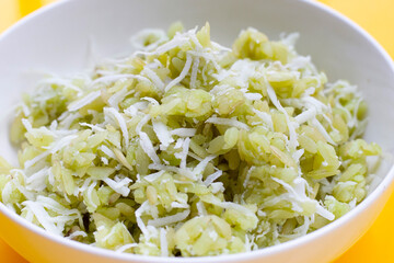 Green rice Thai dessert with coconut (Khao Mao)