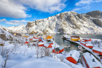 Fototapeta premium Stunning morning seascape of Norwegian sea and cityscape of Nusfjord village.