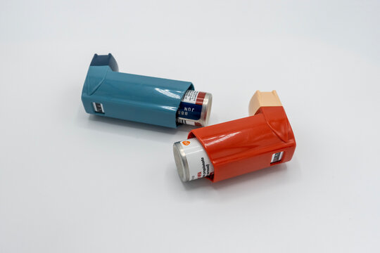 Seattle, WA USA - circa December 2022: Close up view of Albuterol and Flovent inhalers on a white background.