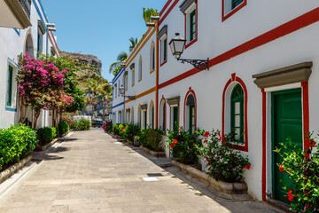 historic center of puerto de mogan with lots of bougainvillea flowers, Canary Island