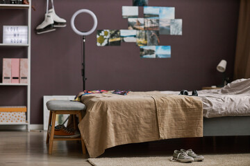 Teenagers room interior with bed hobbie items