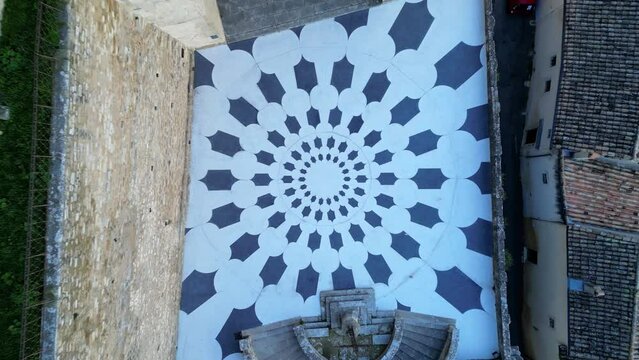 View of the courtyard in front of the castle of Grignan in the Drome during sunset, France, Europe. Abstract patterns in the courtyard