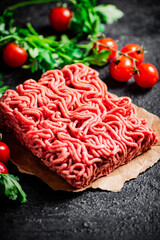 Raw minced meat with parsley and tomatoes. 