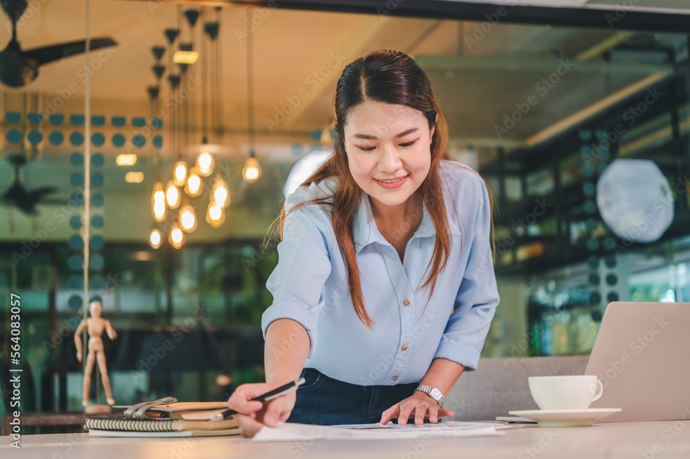 Poster Asian business woman working using  laptop for do math finance on wooden desk, tax, accounting, statistics and analytical research concept