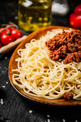 Delicious spaghetti bolognese in a bowl with cherry tomatoes. 
