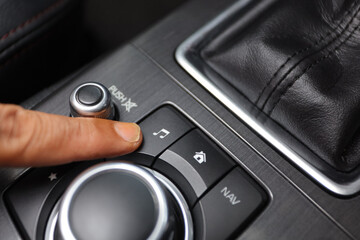 Driver turning button of muisc in car
