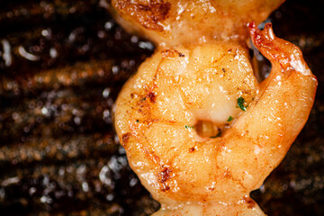 Grilled shrimp in a frying pan. 
