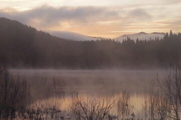 Fototapeta na wymiar A landscape photo of a lake that feels quiet. winter landscape. Quiet impression.