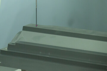 The  CMM machine measuring the graphite electrode parts .