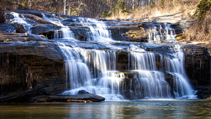 Obraz premium Flowing waterfall in the forest