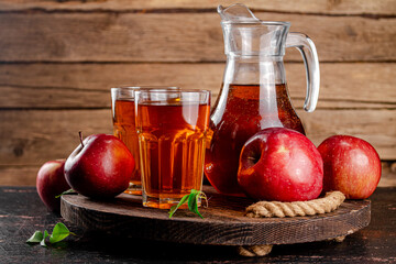 Juice from ripe red apples on tray. 