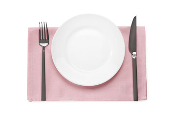 Clean plate and shiny silver cutlery on white table, flat lay