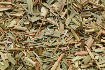 Aromatic dried lemongrass as background, top view