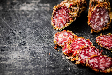 Cut into round pieces of salami sausage. 