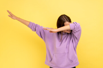 Winning, success gesture. Portrait of woman showing dab dance pose, famous internet meme,...