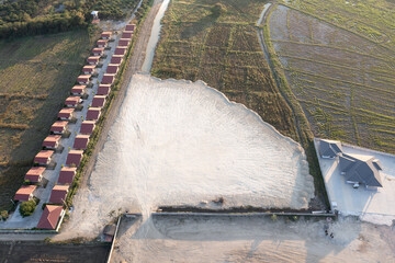 Land, field and soil backfill in aerial view. Include landscape, home house building, empty or...