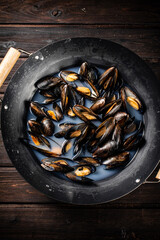 Mussels in a pot of water. 