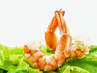 Fresh steamed  prawns with vegetable salad isolate on white background. Boiled , shrimp with mixed green salad . Selective focus depth of field.