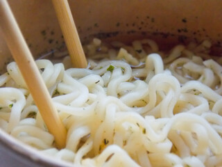 Noodles in a box with wooden sticks