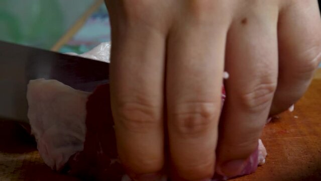 Big knife cut raw pork organic red meat on chopping board. Butchers shop. Barbecue grill