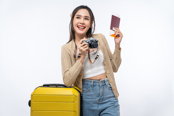 Happy Asian woman traveler with luggage, camera, passport and boarding pass ticket isolated on white background, Tourist girl having cheerful holiday trip concept.