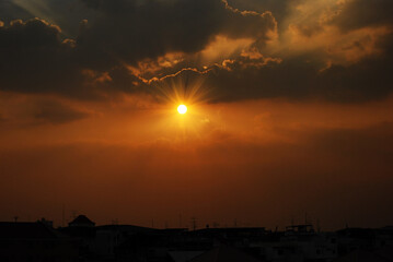 Scenic view dramatic beautiful sunset sky. Natural Sunset Sunrise on meadow silhouette shadow dark land. Vibrant dramatic sky on sunset, dawn, sunrise in Countryside. Landscape Colorful Sky At Sunset
