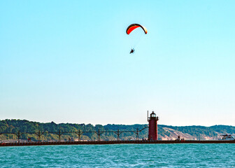 A powered paraglider sails above Lake Michigan off the coast of South Haven.