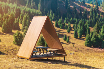 Landscape in the summer mountains of almaty with gazebo for tourists.