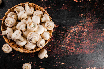 Mushrooms in a basket on the table. 