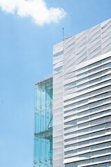 Blue building with the sky as the background