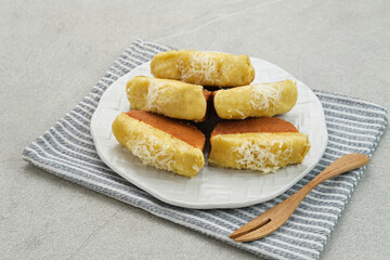 Pukis or Kue Pukis, popular traditional snack in Indonesia. Served in white plate 
