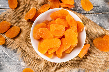 Fragrant dried apricots in a bowl on the table. 