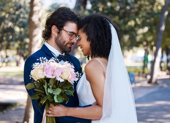Married couple, flower bokeh and smile for wedding, marriage or loving commitment together in the...