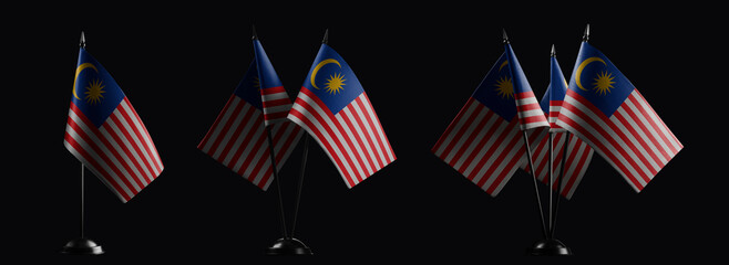 Small national flags of the Malaysia on a black background