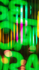 Defocused abstract green neon words photo background