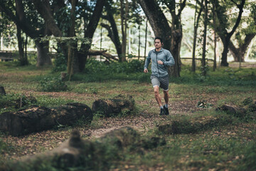 healthy lifestyle young fitness man running the forest. Outdoor workout,  Healthy lifestyle concept.