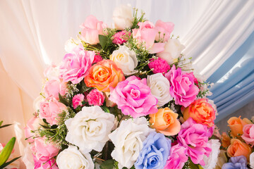 Many kinds of beautiful fake flowers for setting up the backdrop in various ceremonies