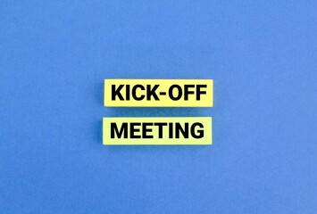 colored paper with the word meeting kick-off. Kick-off meeting concept.
