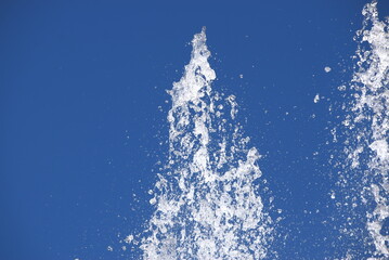 water splash on the blue sky background