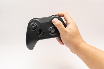 game controller with hand on white background. Black game controller isolated background.