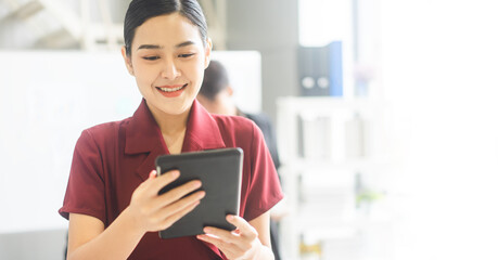 Business woman using digital tablet banner size background